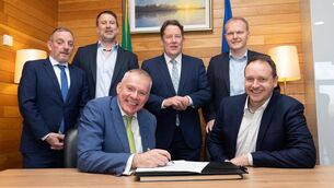 <p>Niall MacCarthy, Managing Director, Cork Airport, signs an agreement for a solar carport at the airport with John Carty, Greenvolt Ireland chief commercial officer. They were joined by Minister of State at Department of Transport, Jerry Buttimer, Brian Warren, construction director, Greenvolt Next; Transpirt Minister Darragh O'Brien; and Seamus McGrath TD. Picture: Darragh Kane</p>