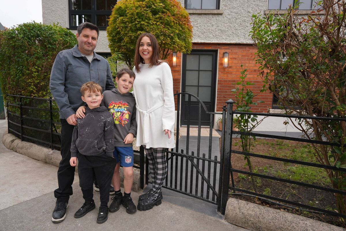 Robert and Grace with their children outside their home, a finalist in episode five. 