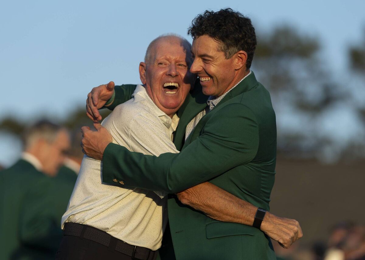 Rory McIlroy celebrates with his dad Gerry after winning back-to-back Masters at Augusta National. Picture: Augusta National/Getty