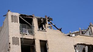 Damage is visible on the facade of a residential building in Iran (Vahid Salemi/AP) Damage is visible on the facade of a residential building in Iran (Vahid Salemi/AP)