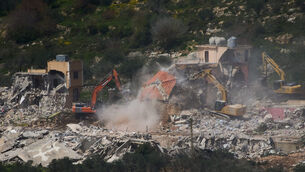 Israeli bulldozers demolish homes in southern Lebanon (Ariel Schalit/AP)