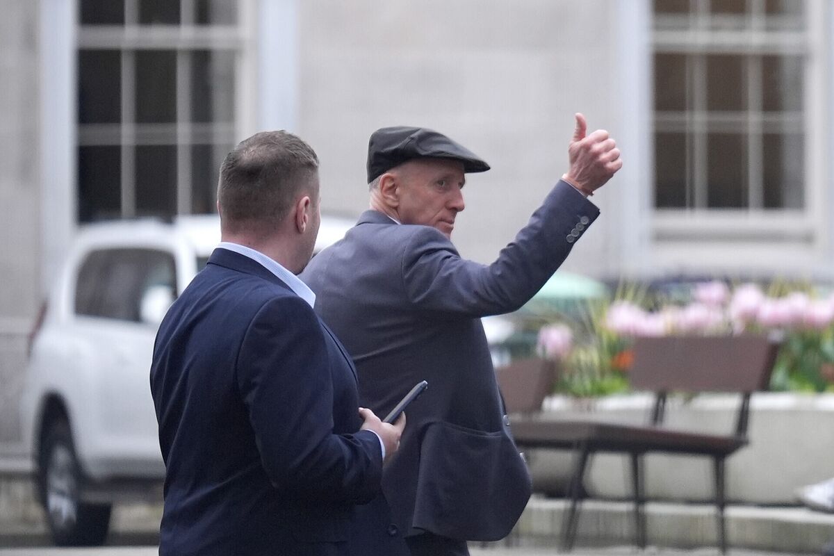 Michael Healy-Rae gives a thumbs-up to the crowds gathered outside Leinster House after resigning as Minister of State. Picture: Niall Carson/PA Wire