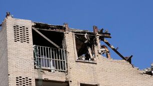 <p>Damage is visible on the facade of a residential building that, according to Iranian authorities, was hit by a strike. Picture: AP Photo/Vahid Salemi.</p>