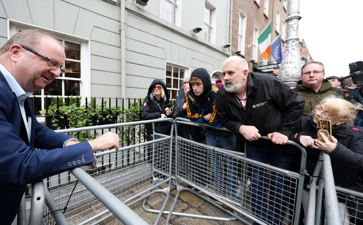 Independent TD Michael Collins (left) talking to fuel price protesters outside Leinster House on Tuesday. Photo: Leah Farrell/© RollingNews.ie