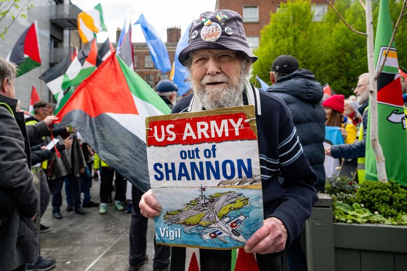 Protesters accompany 91-year-old peace activist Lelia Doolan as she continues her campaign against the use of Shannon Airport by the US military. Picture: Chani Anderson