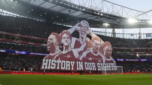 <p>KEEPING THE FAITH: Arsenal fans hold up a giant banner in the stands before the UEFA Champions League quarter-final second leg match at the Emirates Stadium. Picture: Nick Potts/PA Wire.</p> <p>KEEPING THE FAITH: Arsenal fans hold up a giant banner in the stands before the UEFA Champions League quarter-final second leg match at the Emirates Stadium. Picture: Nick Potts/PA Wire.</p>