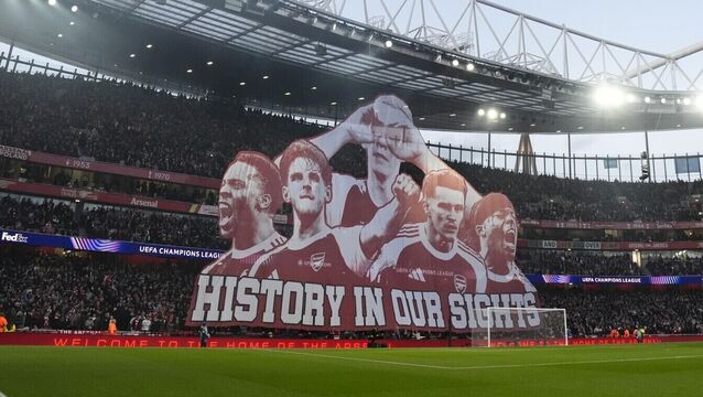 <p>KEEPING THE FAITH: Arsenal fans hold up a giant banner in the stands before the UEFA Champions League quarter-final second leg match at the Emirates Stadium. Picture: Nick Potts/PA Wire.</p>