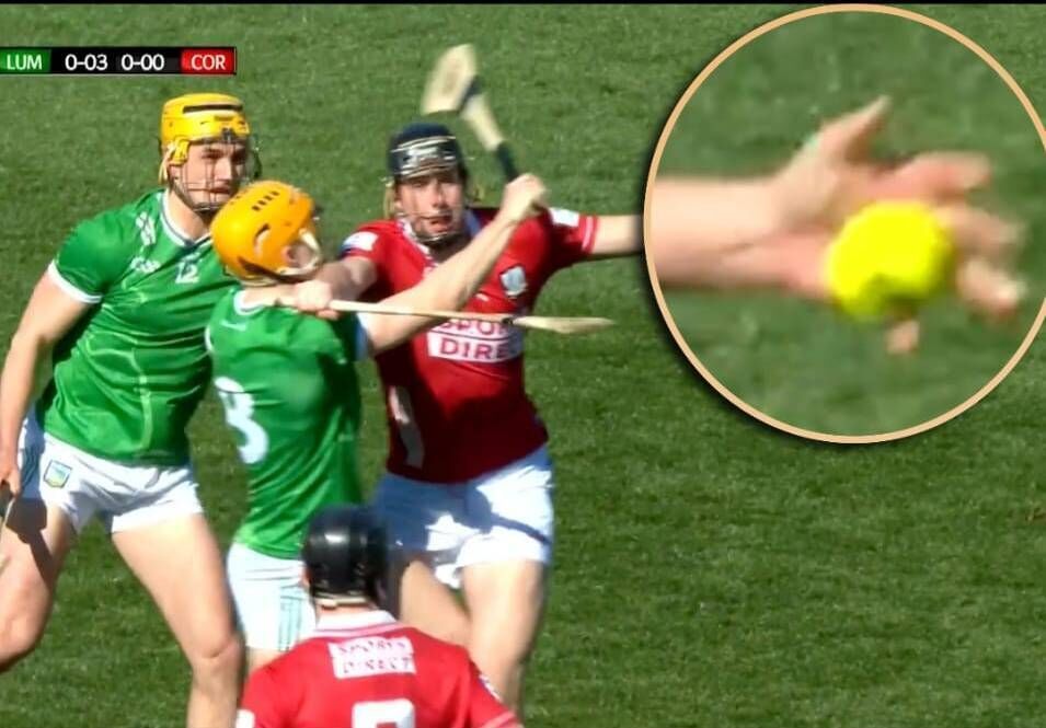 Rob Downey gets his handpass away under pressure