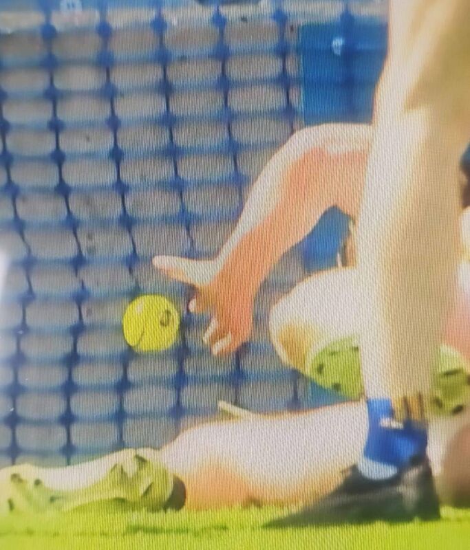 Eoin Cody releases a handpass while on the ground. Eoin Cody releases a handpass while on the ground.