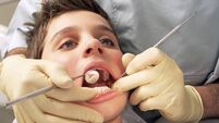 Close-up of boy having teeth examined