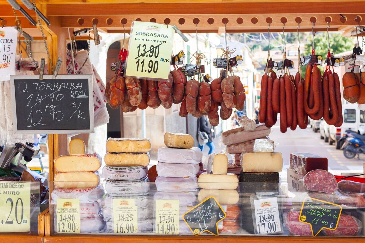 Traditional Majorcan Sobrasada saussage and Mahon cheese for sale at a local market, Menorca Traditional Majorcan Sobrasada saussage and Mahon cheese for sale at a local market, Menorca