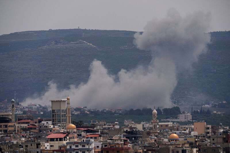 Smoke rises following an Israeli airstrike on the village of Qlaileh, as seen from the southern port city of Tyre, Lebanon, Wednesday, April 15, 2026. (AP Photo/Hussein Malla)