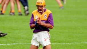 <p>George O'Connor praying after the All-Ireland victory in 1996. Pic: Kieran Clancy </p>