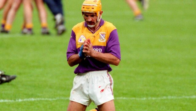 <p>George O'Connor praying after the All-Ireland victory in 1996. Pic: Kieran Clancy </p>