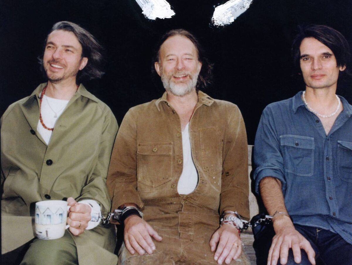 The Smile are an English rock band comprising the Radiohead members Thom Yorke and Jonny Greenwood, with Tom Skinner The Smile are an English rock band comprising the Radiohead members Thom Yorke and Jonny Greenwood, with Tom Skinner