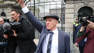 <p>Kerry TD Michael Healy-Rae gestures to the protesters outside Leinster House ahead of voting no confidence in the Government over the fuel crisis. Picture: Stephen Collins/Collins</p>