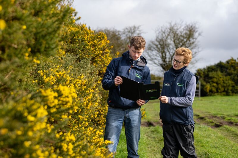 Kay O’Sullivan and Conor Sexton, Teagasc Dry Stock Advisor for the Mallow region, pictured beside a native gorse hedgerow at Kay O’Sullivan’s organic farm, Glynn Farm, near Mallow. Picture: Chani Anderson