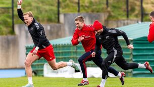 <p>Munster's Mike Haley and Jack Crowley race. Pic: Morgan Treacy/Inpho</p>