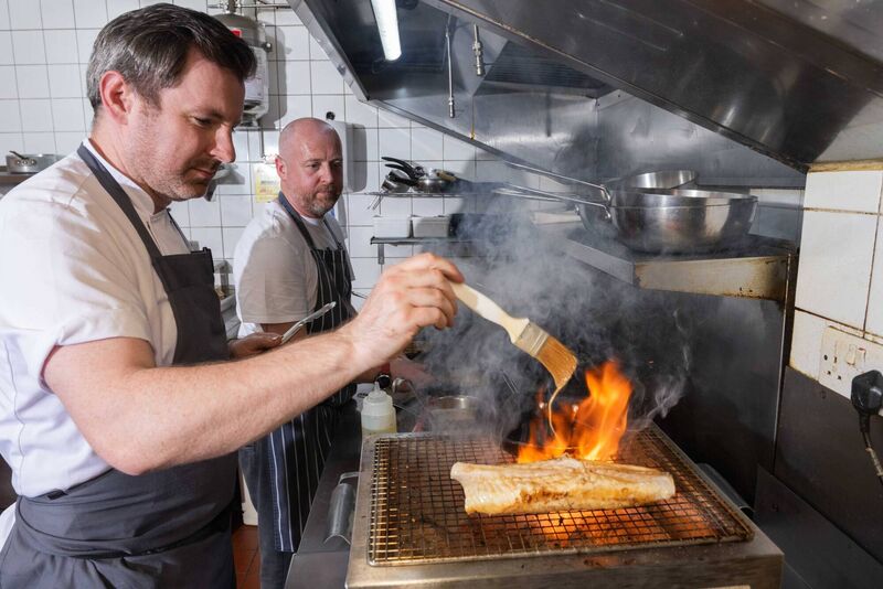 Guest chef Patrick Powell and The Tannery's Head Chef Damien Derwin pictured working together in the kitchen during An Evening with Chef Patrick Powell at The Tannery, Dungarvan, as part of Waterford Festival of Food. Picture: Joleen Cronin