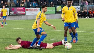 <p>STALEMATE: Cobh Ramblers' Callum Honohan looks for a penalty as Longford's Pharrell Manuel clears the ball. Pic: Howard Crowdy.</p>