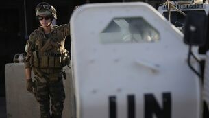 <p>A French UN peacekeeper stands beside an armored vehicle at his base, waiting to move with his unit for a patrol along the Lebanese-Israeli border in Deir Kifa, southern Lebanon. (AP Photo/Hussein Malla)</p>