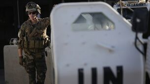 <p>A French UN peacekeeper stands beside an armored vehicle at his base, waiting to move with his unit for a patrol along the Lebanese-Israeli border in Deir Kifa, southern Lebanon. (AP Photo/Hussein Malla)</p>