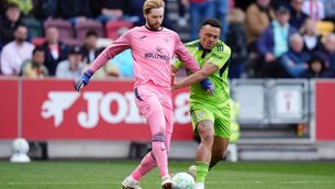 <p>CLEAN SHEET: Brentford goalkeeper Caoimhin Kelleher and Fulham's Rodrigo Muniz battle for the ball. Pic: John Walton/PA Wire.</p>