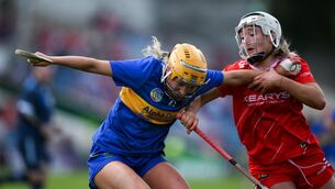<p>TIPP ON TOP: Tipp's Amy Quinlisk in action against Cork's Ava McAuliffe. Pic: Brendan Moran/Sportsfile.</p>