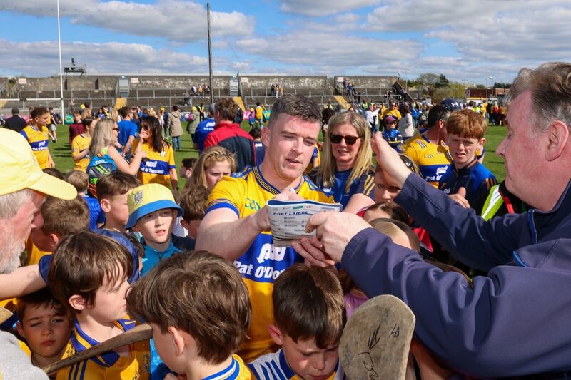 Tony Kelly signs autographs for fans after the game. Pic: ©INPHO/Natasha Barton.