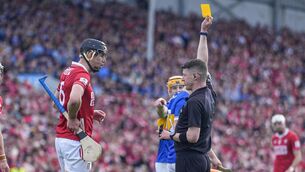 <p>Robert Downey of Cork receives a yellow card from Seán Stack. Pic: ©INPHO/James Lawlor</p>