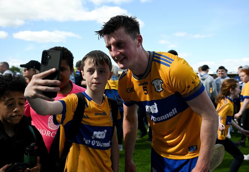 Diarmuid Ryan of Clare with a young supporter after the Munster GAA Senior Hurling Championship Round 1 match between Clare and Waterford. Pic: Ray McManus/Sportsfile