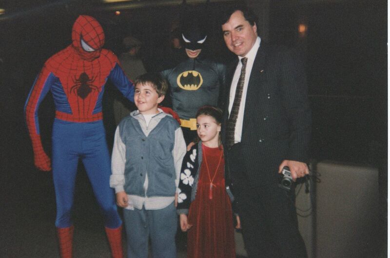 Carl Mullan, his sister Emma and father Don meeting superheroes on a holiday in America around 1998.