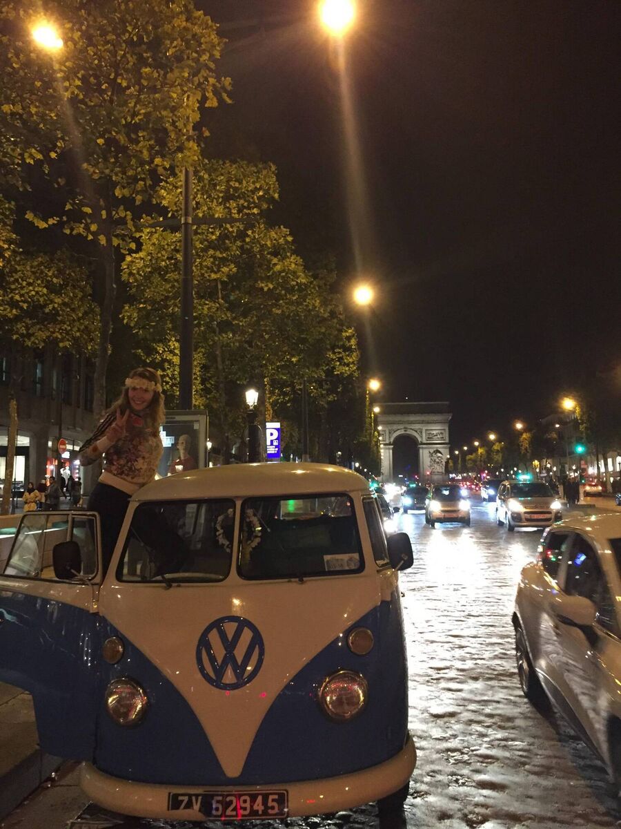 Martha Timlin and her VW arrive in the Avenue des Champs-Élysées in Paris.
