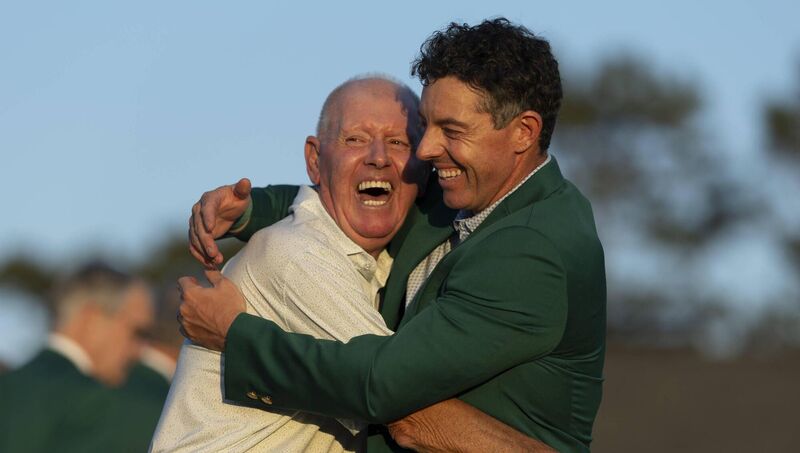 FATHER'S DAY: Masters champion Rory McIlroy celebrates with dad Gerry after going back to back at Augusta National.