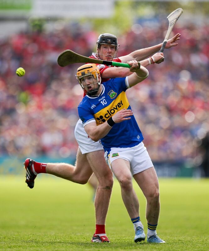 TUNED IN: Jake Morris of Tipperary and Eoin Downey of Cork contest a dropping ball on Sunday. Picture: Brendan Moran/Sportsfile