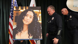 LAPD chief Jim McDonnell walks past an image of Celeste Rivas Hernandez in Los Angeles after a press conference regarding the case of singer D4vd, who was charged on suspicion of killing the 14-year-old (Damian Dovarganes/AP)
