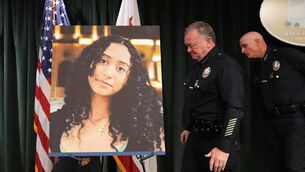 <p>LAPD chief Jim McDonnell walks past an image of Celeste Rivas Hernandez in Los Angeles after a press conference regarding the case of singer D4vd, who was charged on suspicion of killing the 14-year-old (Damian Dovarganes/AP)</p>