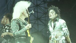 <p>Michael Jackson with guitarist Jennifer Batten on stage at Páirc Uí Chaoimh in Cork in 1988. Picture: Irish Examiner Archive</p>