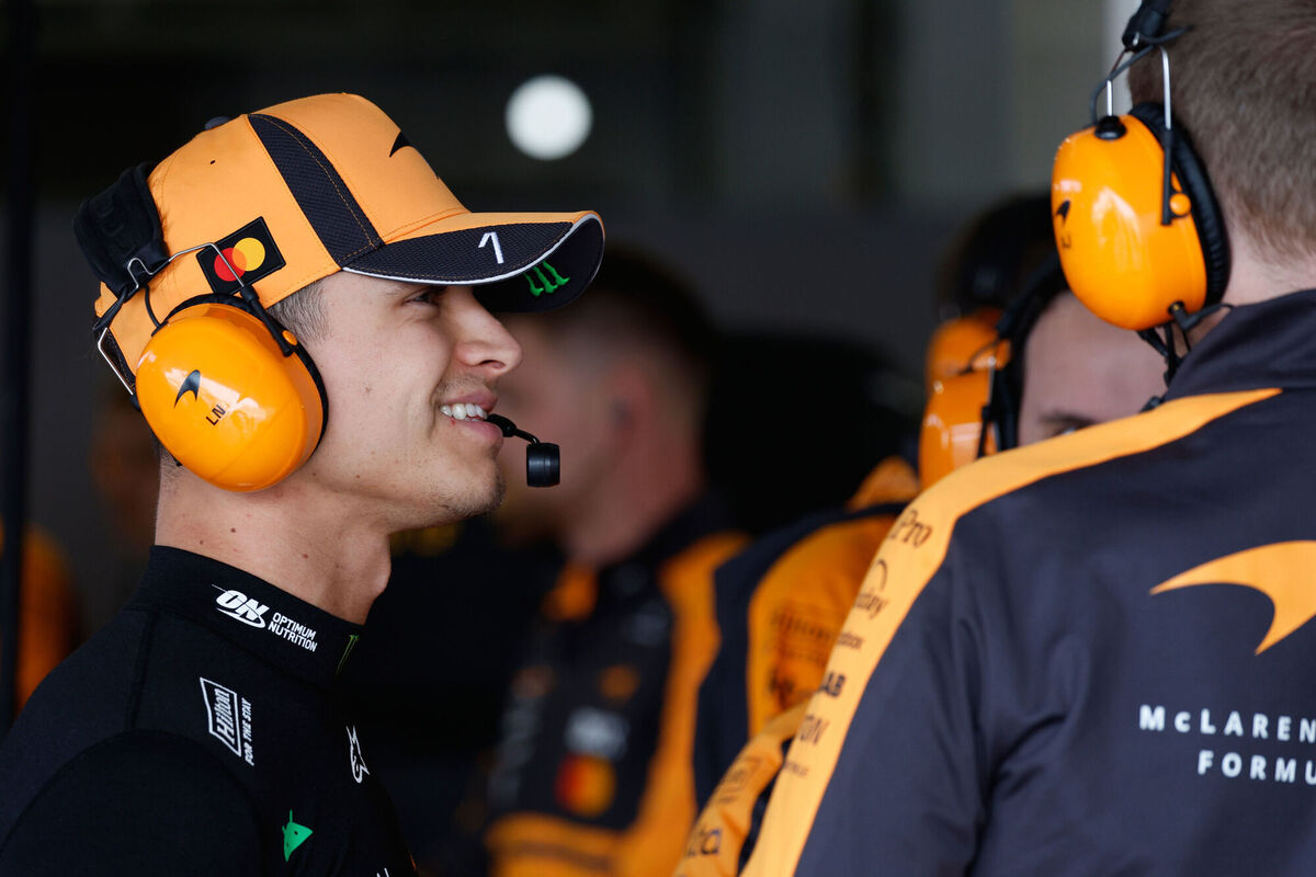 McLaren driver Lando Norris talks with team members. Pic: Franck Robichon/Pool Photo via AP.