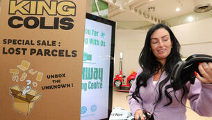 <p>Stacey Collopy just about the open her parcel at the King Colis at the Parkway Shopping Centre. Picture: Brendan Gleeson</p>