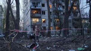 <p>A woman with a dog walks among the rubble of a house damaged after a Russian strike on residential area in Kyiv, Ukraine, on Thursday, April 16, 2026. (AP Photo/Evgeniy Maloletka)</p>