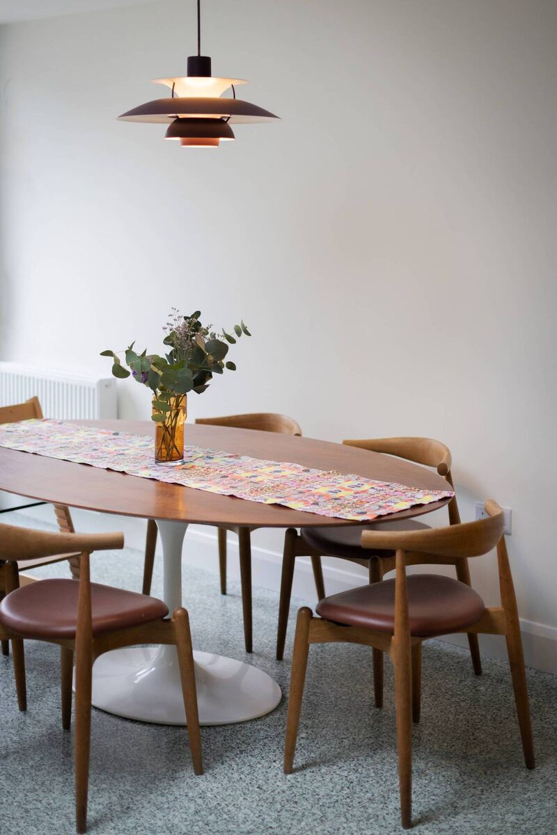 The dining space features a table runner by Emily's pal Helen Steele.