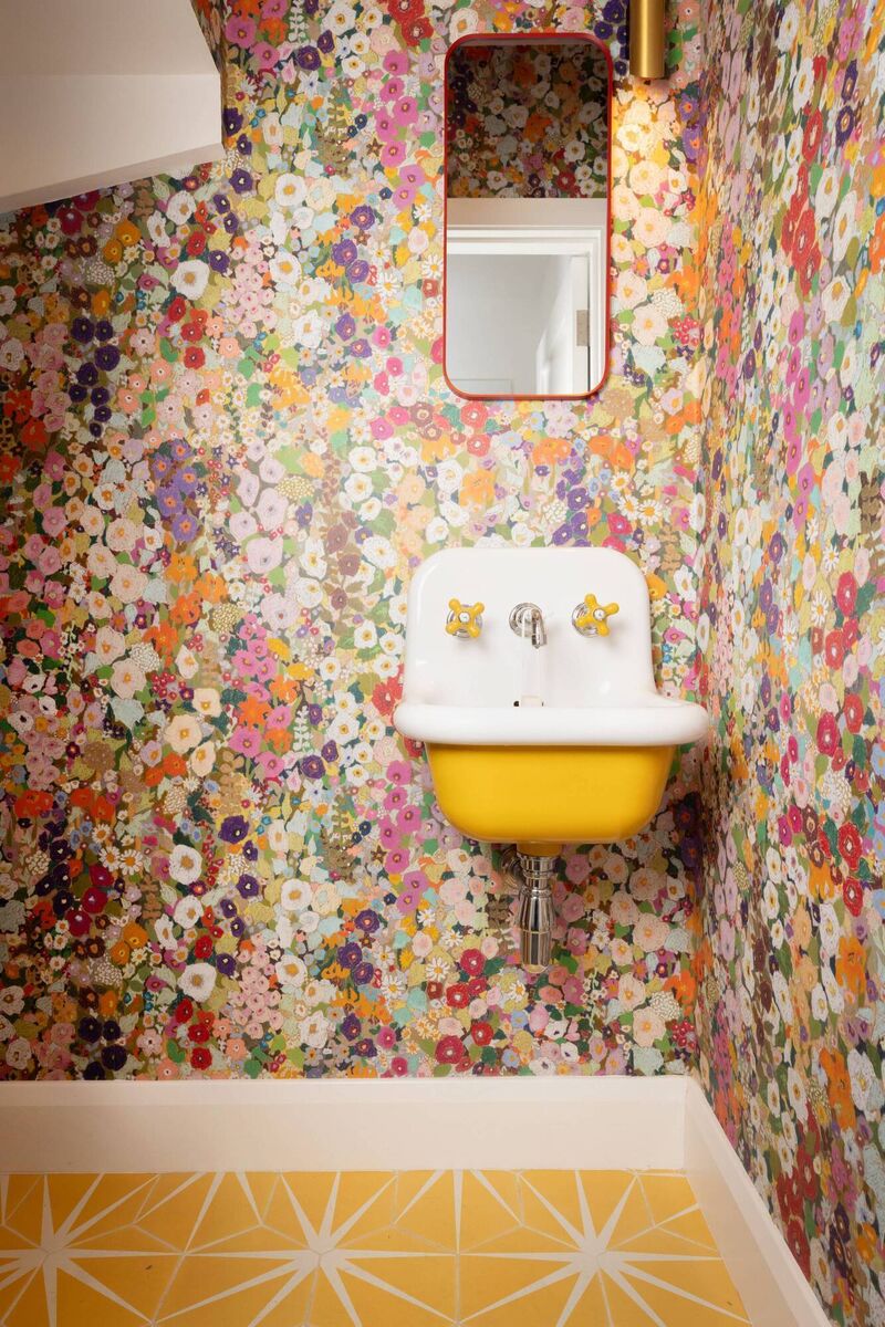 A jaunty sink with citrus yellow accents is the pièce de résistance in our writer's favourite room in the house. The glossy white porcelain base forming the bowl and backsplash gleams against a yellow underside. 