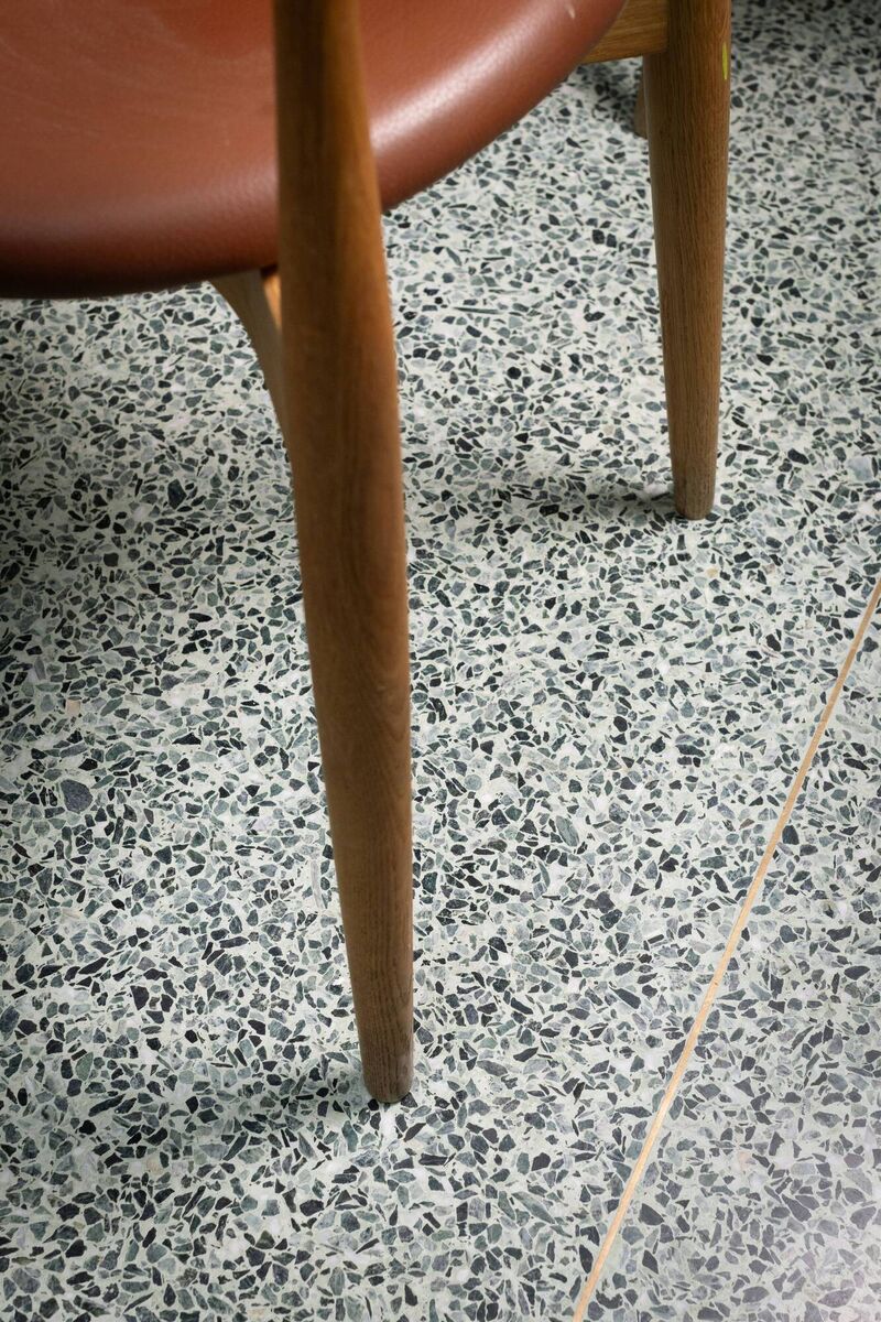 The mint green flooring flecked with mother-of-pearl accents is custom-made by the family-run Irish business JK Terrazzo &amp; Concrete Flooring. 