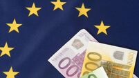 Flag of the European Union EU and Euro banknotes
