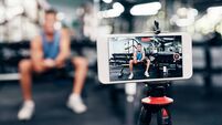 Gym, social media and fitness influencer with phone live streaming workout for interactive multimedia broadcast. Vlog, man filmi