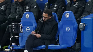 <p>Chelsea manager Liam Rosenior takes notes during the Premier League match at the American Express Stadium, Brighton. Picture date: Tuesday April 21, 2026.</p>