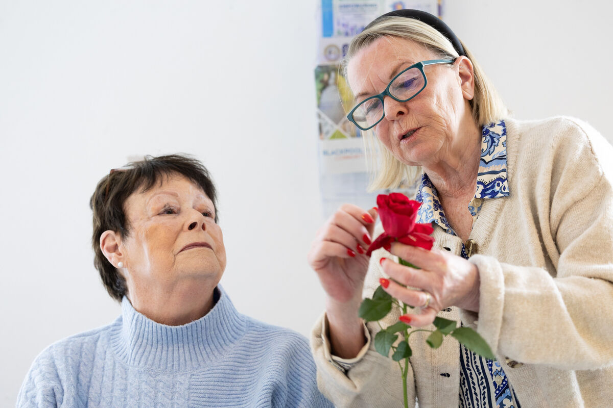 Florist Elaine O’Sullivan teaching Margaret Harty from Glanmire at a summer flower arranging demonstration in Cork City Partnership, Mayfield, for the first day of this year's Cork Life Long Learning Festival. Photo: Darragh Kane