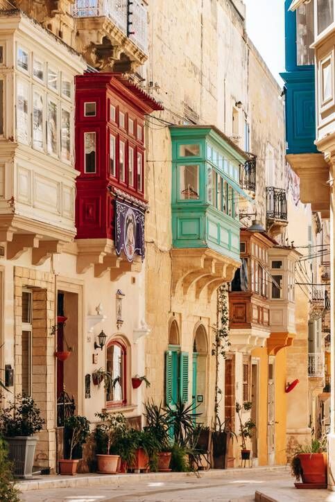 Limestone facades with traditional wooden balconies in the old town of Senglea