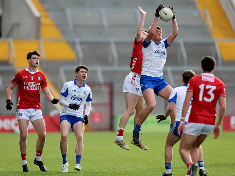 Cork's Mark O'Brien and Wateford's Diarmuid Mackie battle for the high ball. Pic: Jim Coughlan.